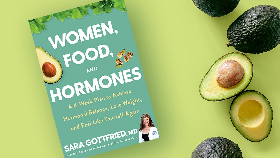 A picture of Sara Gottfried's new book next to avocados