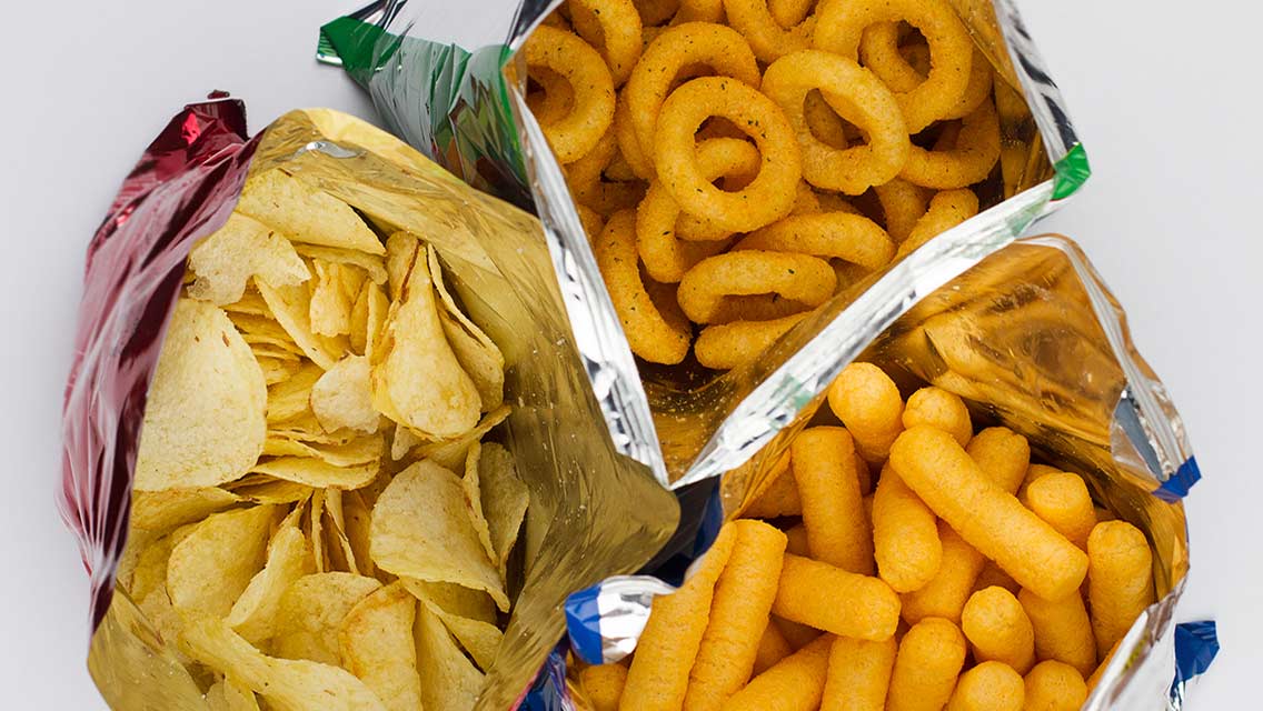 bags of processed chips and puffs