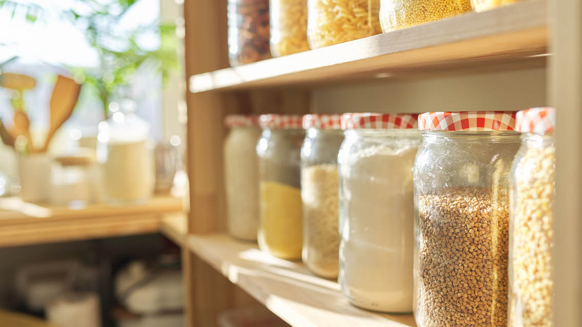 pantry shelves with jars filled with alternative flours