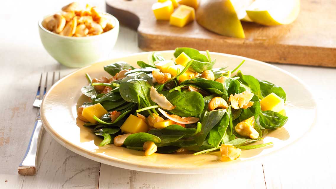 spinach salad with cashews and coconut