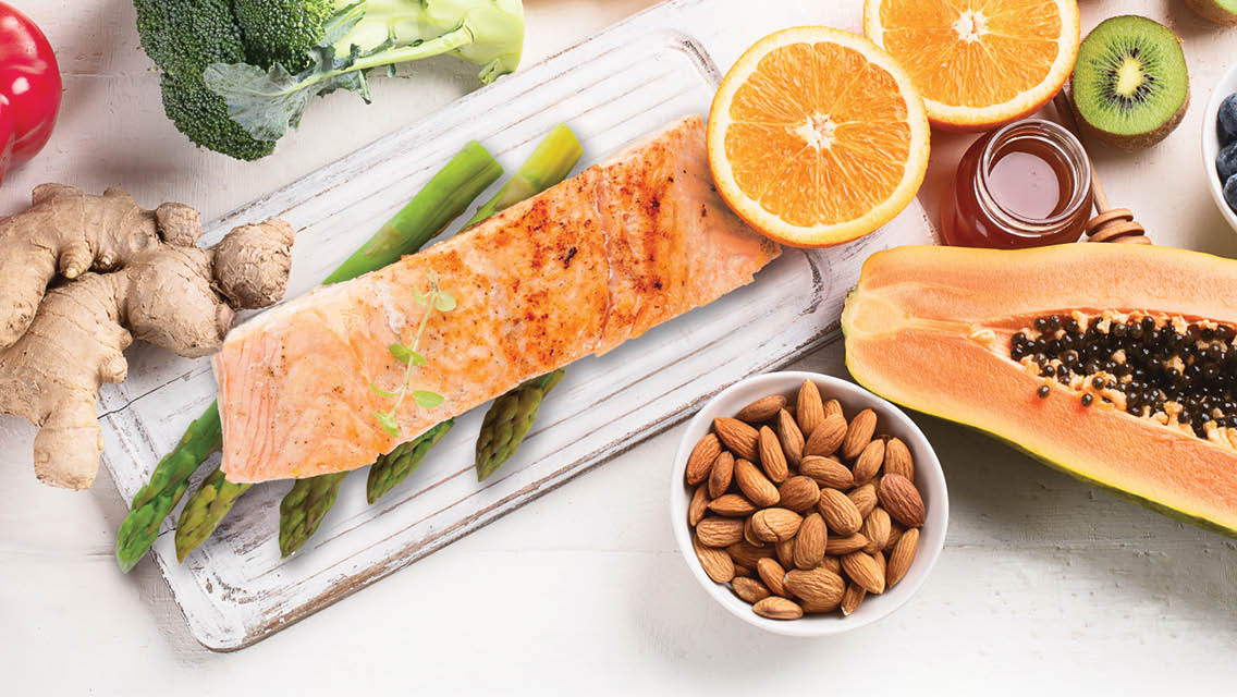 cancer fighting foods: salmon, citrus, nuts, papaya