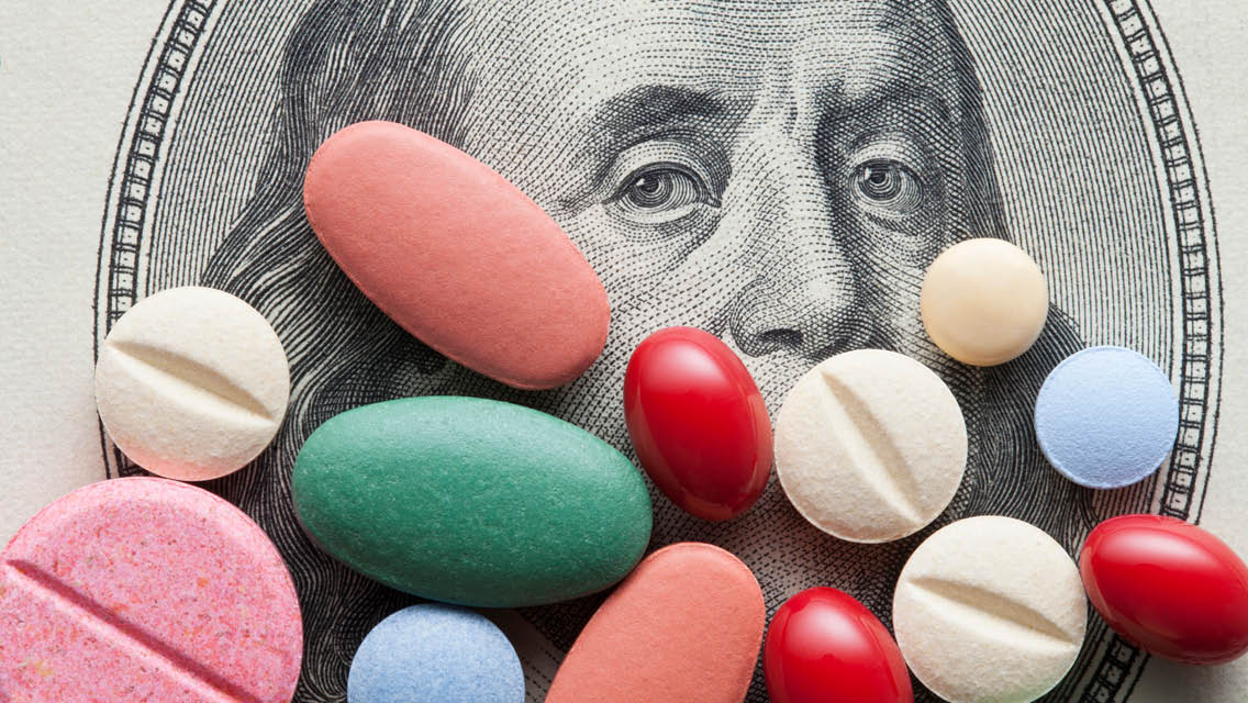 a dollar bill with colorful pills arranged on top