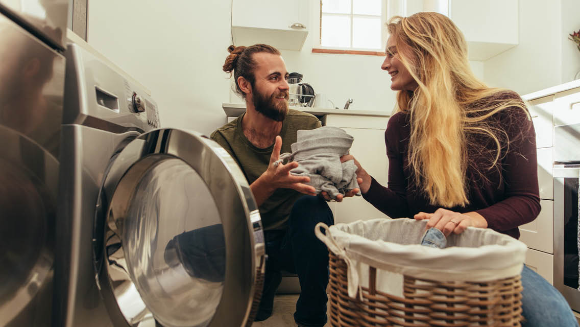 a couple does the laundry