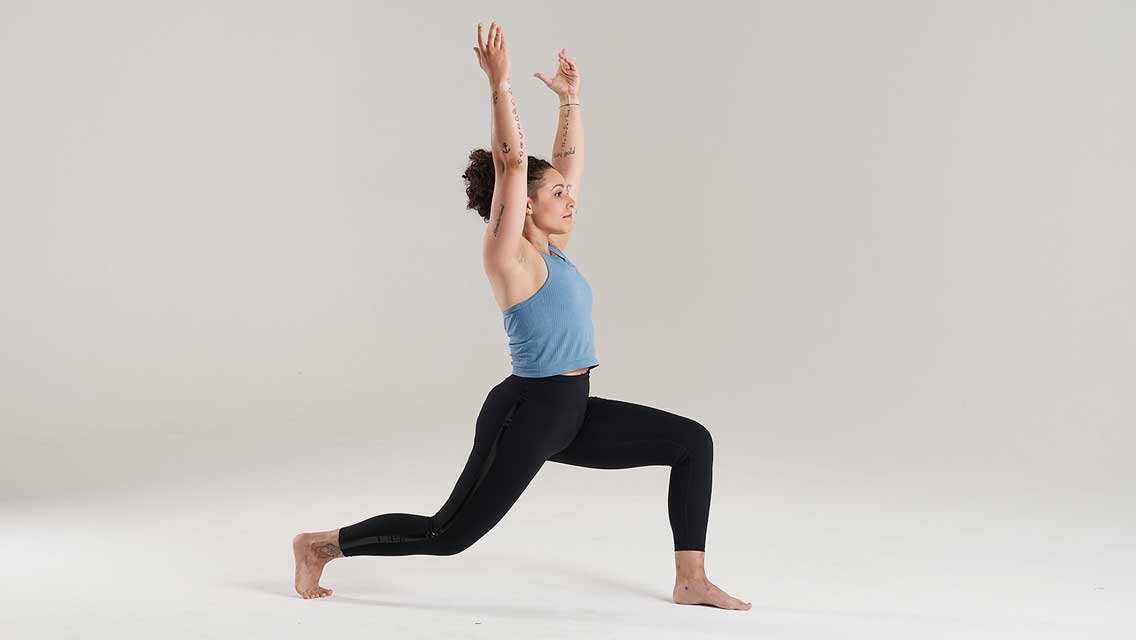 a woman holds crescent lunge