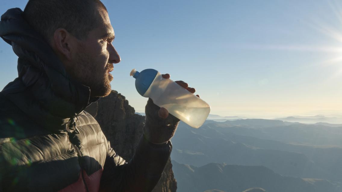 man holding water bottle