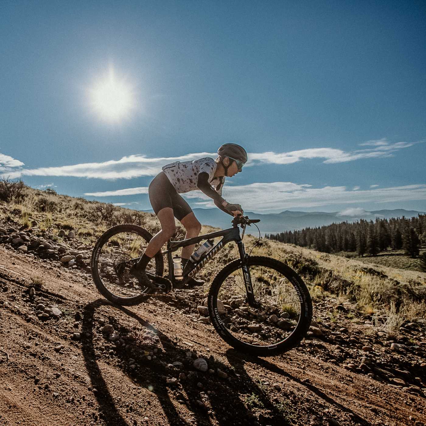 person biking in mountains