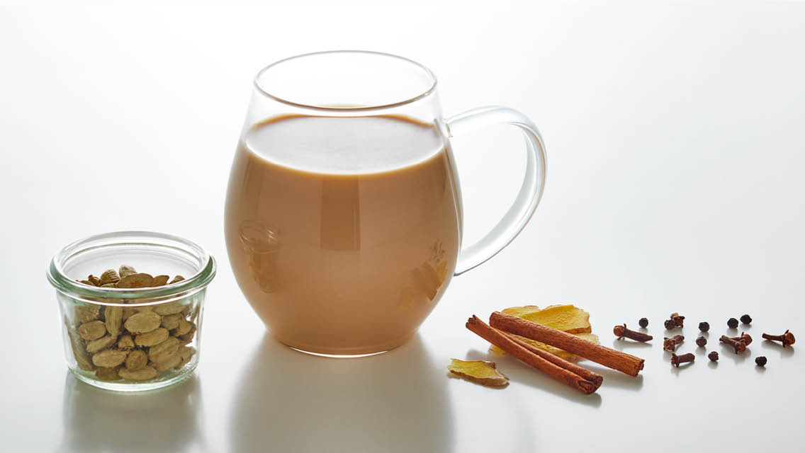 a glass mug of chai