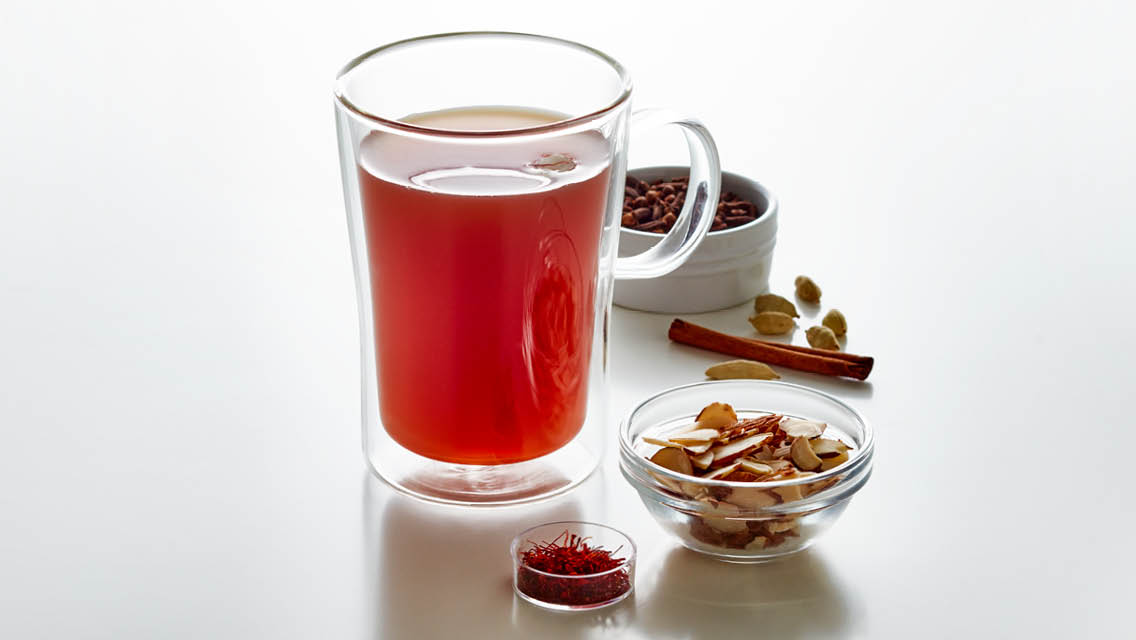 a tall glass mug of spiced tea