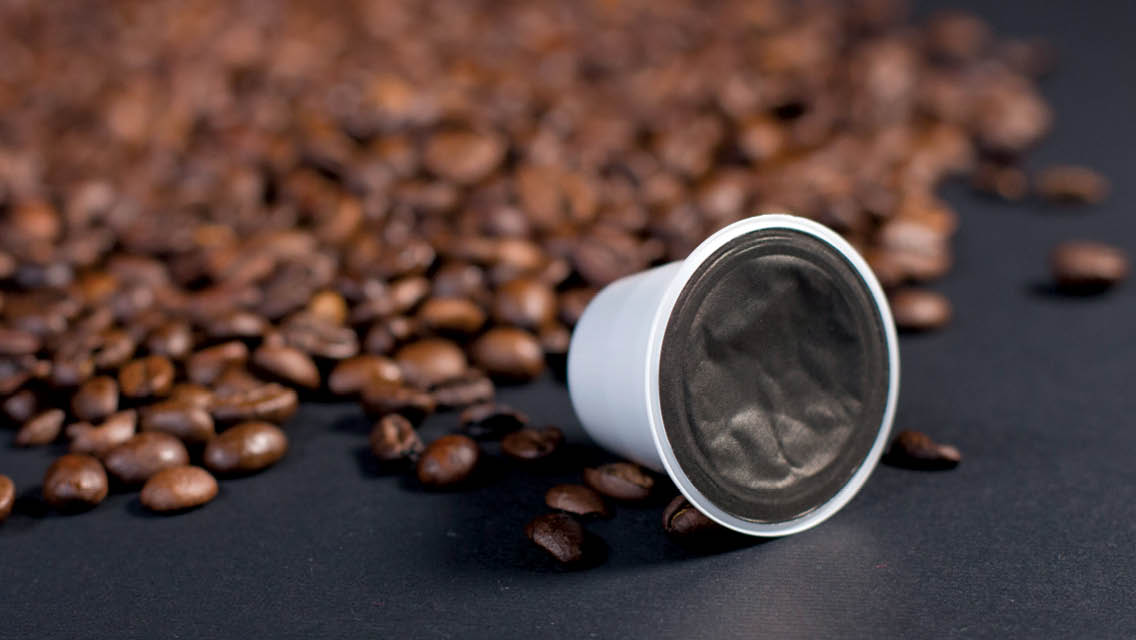 a coffee pod with coffee beans