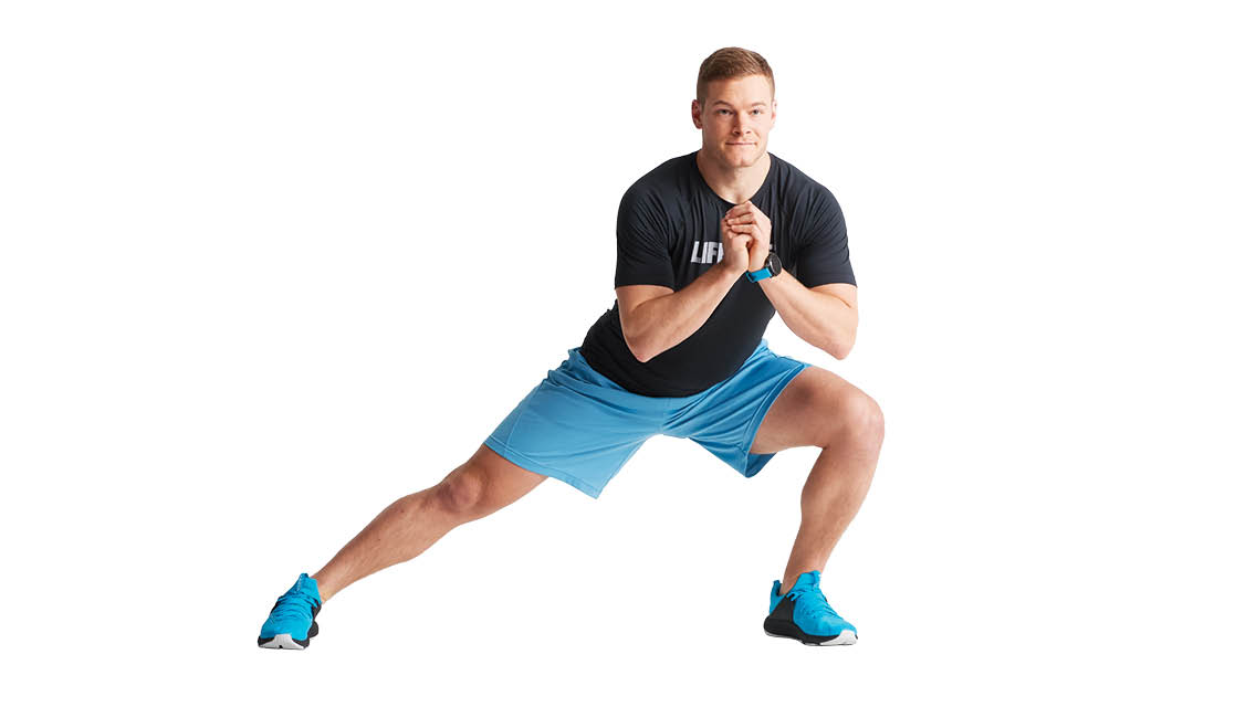 a man performs a side lunge