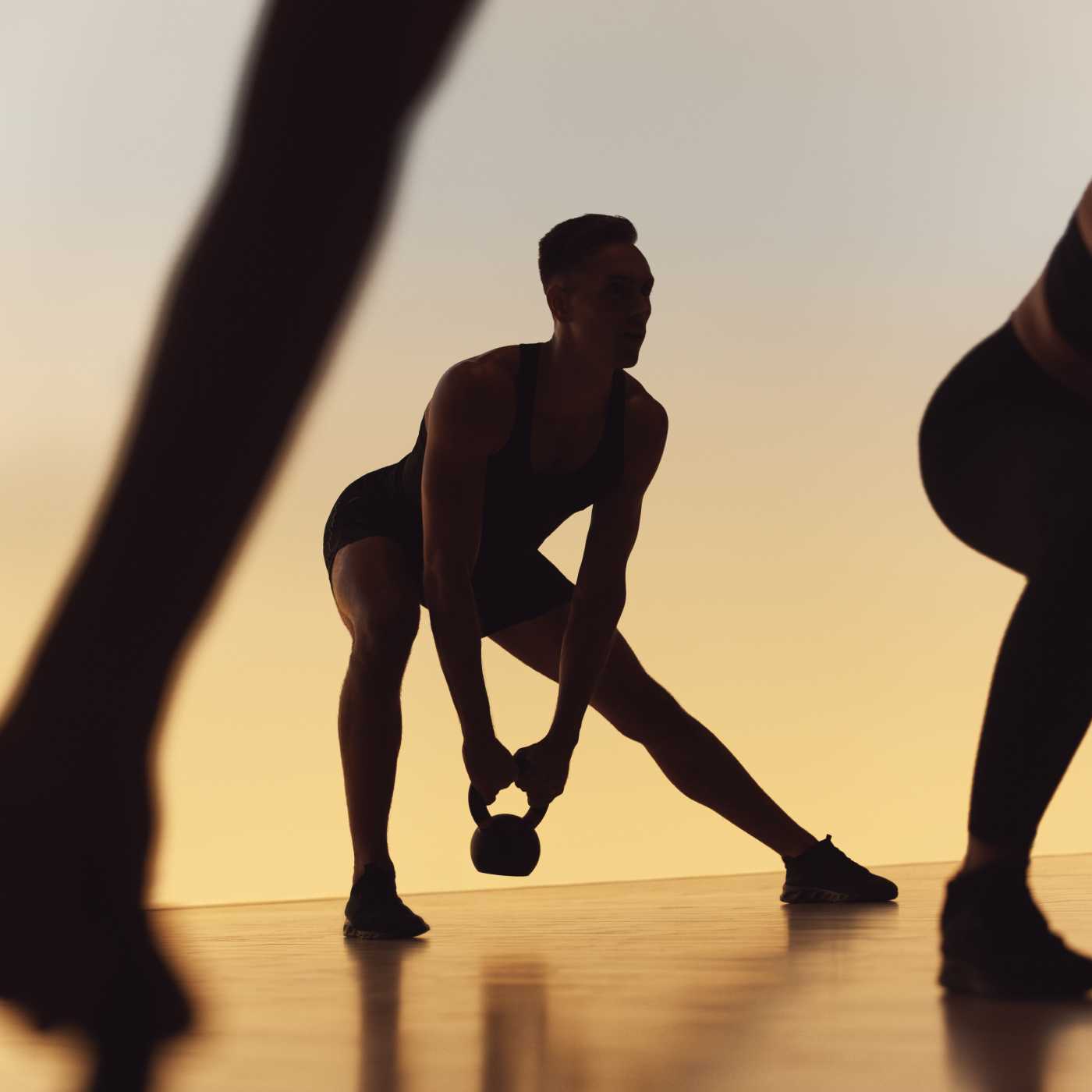 person doing a workout move with kettlebell