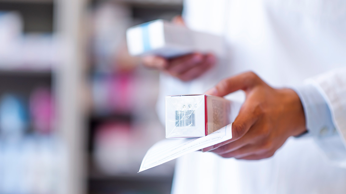 a pharmacists holds a prescription