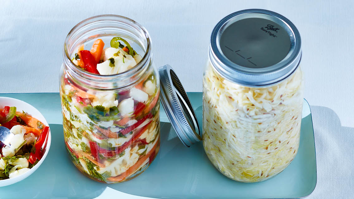 jars of homemade pickled veggies and saurkraut