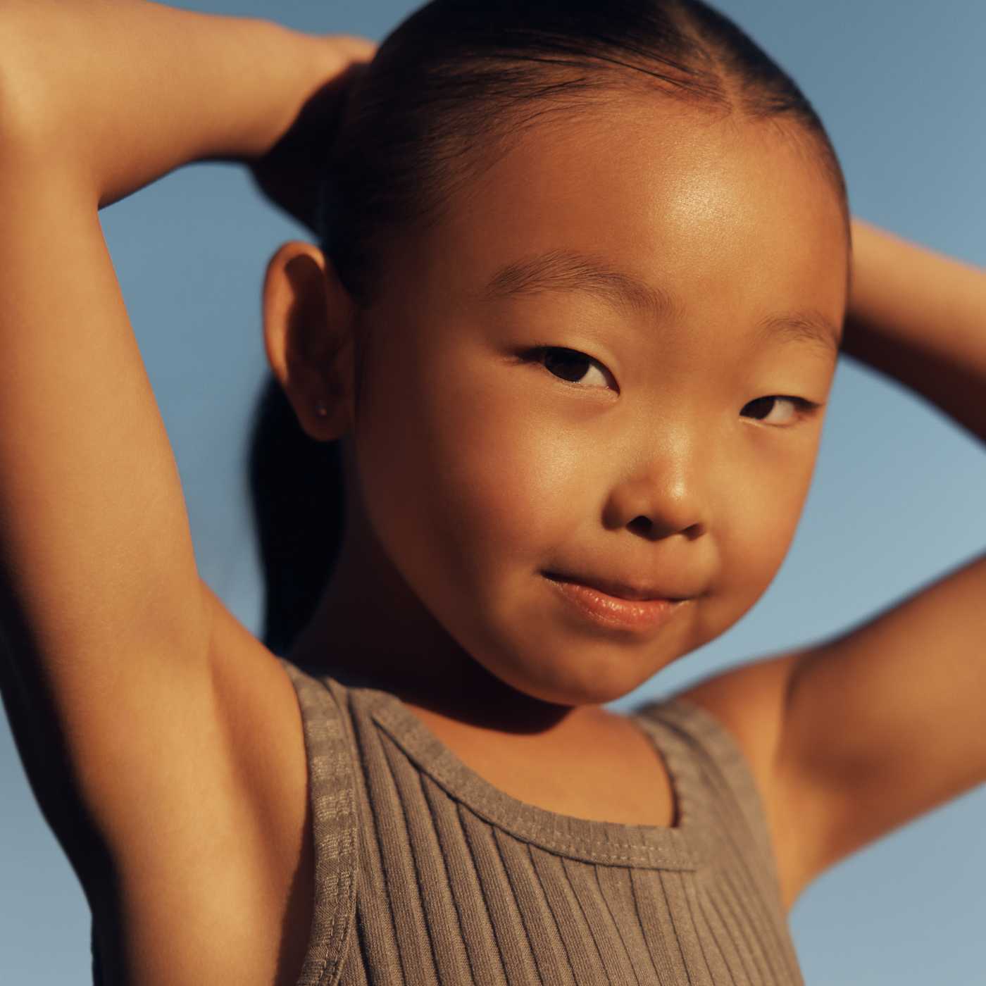 girl with hands on her head