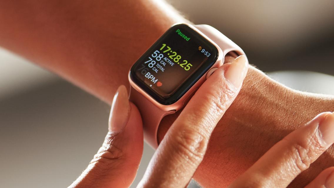 Woman checking her heart rate on apple watch