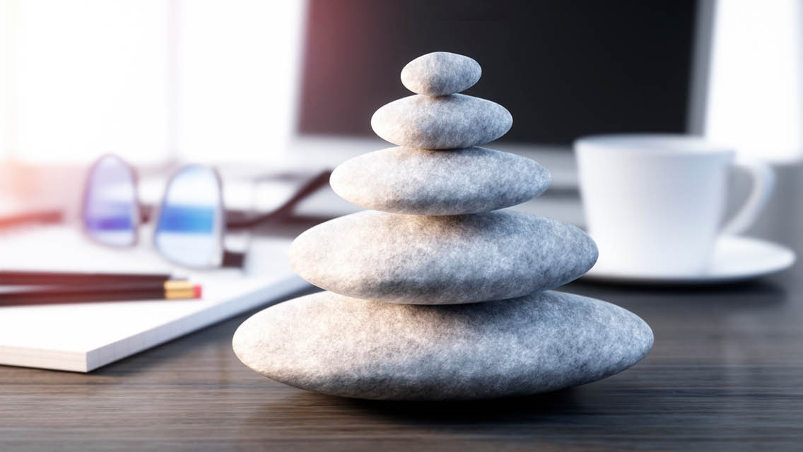 balancing rocks on a desk