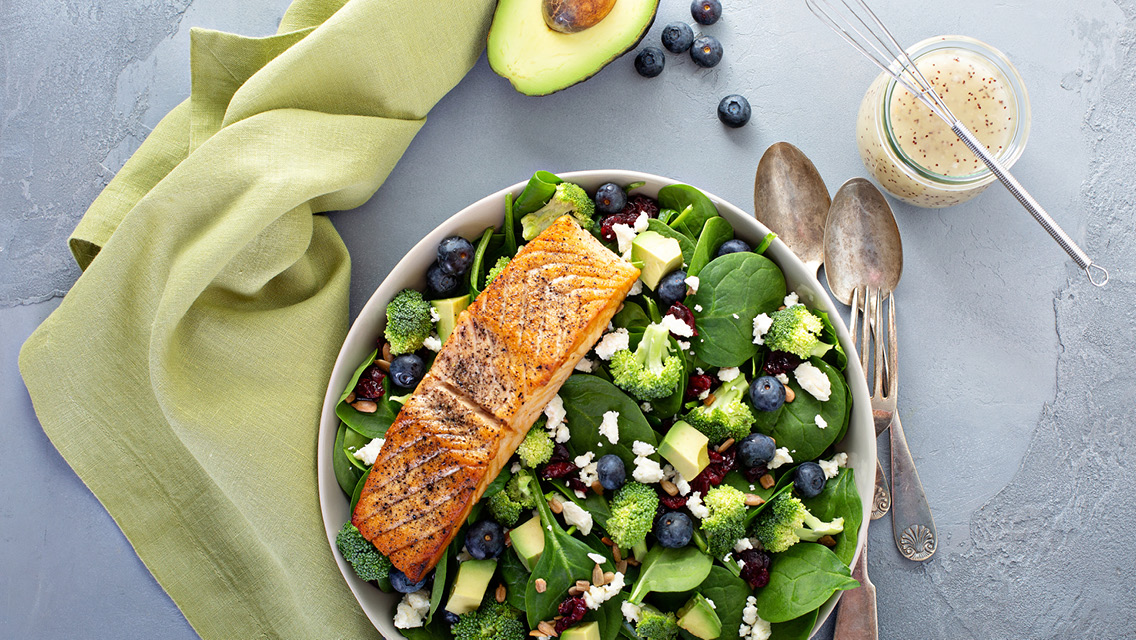 a salad with salmon and other anti-inflammatory foods