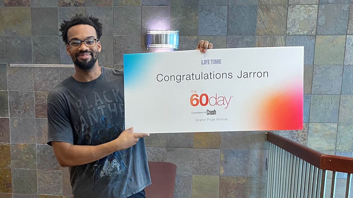 Jarron Lucas holds the 60day winner plaque