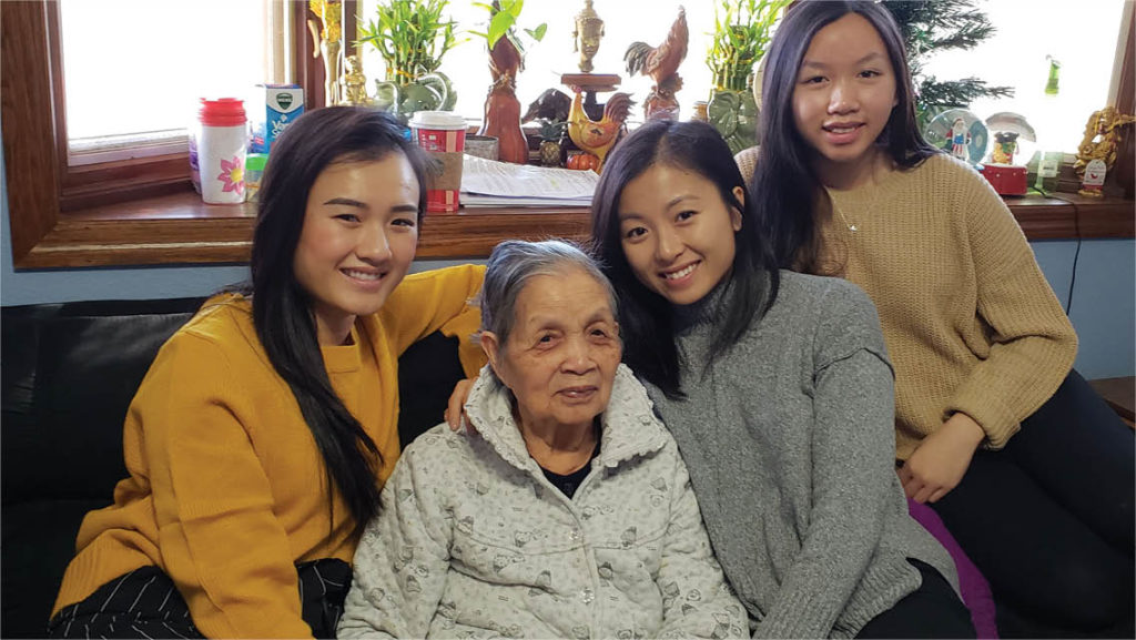 Mia with her family and grandmother