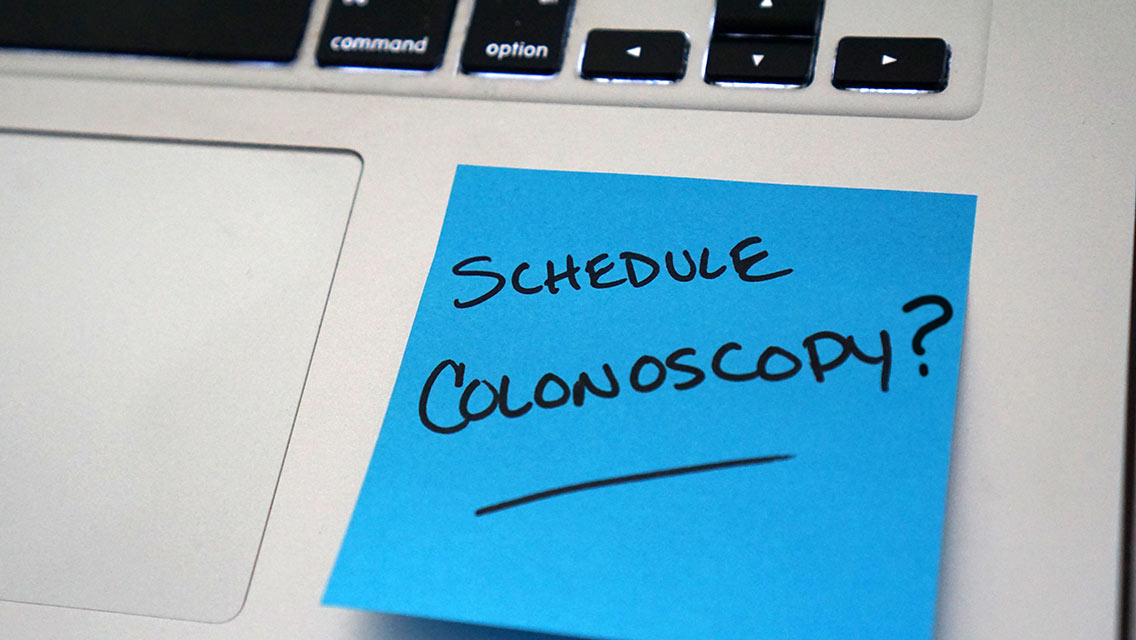 post it note that says schedule colonoscopy?