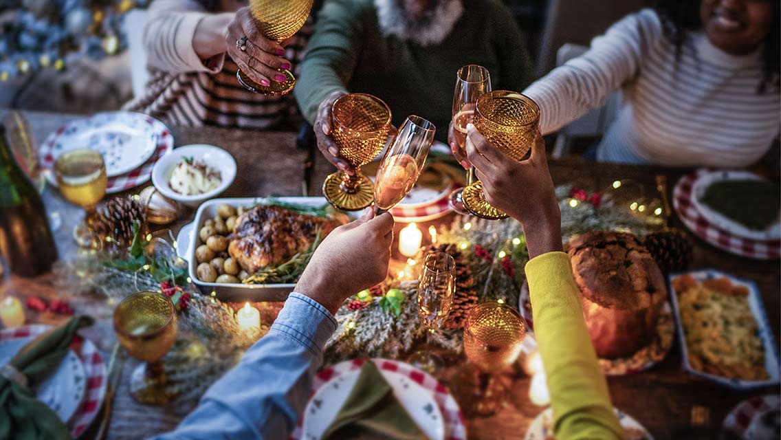people cheers at a festively adorned table