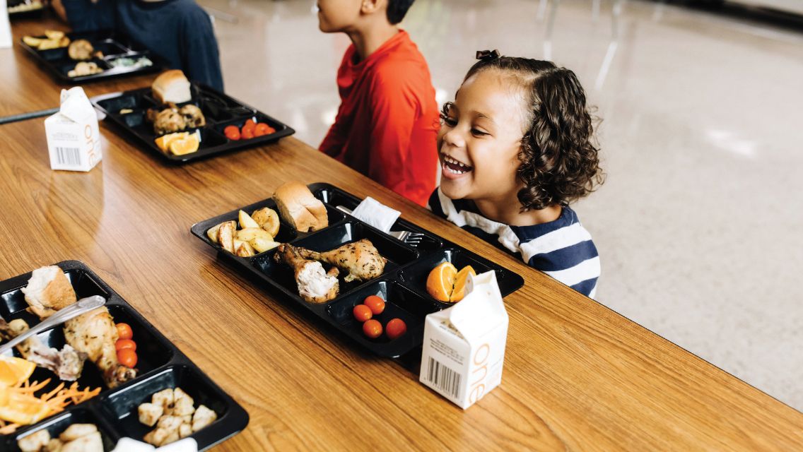 Foundation photo of child eating school lunch