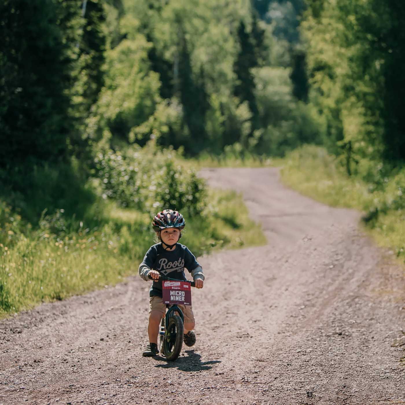 child riding on bike
