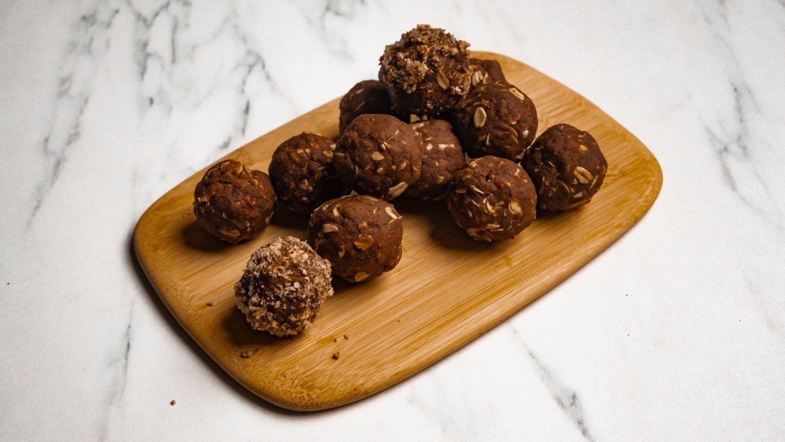 A board filled with Sea Salt Caramel Turtle Protein Balls.