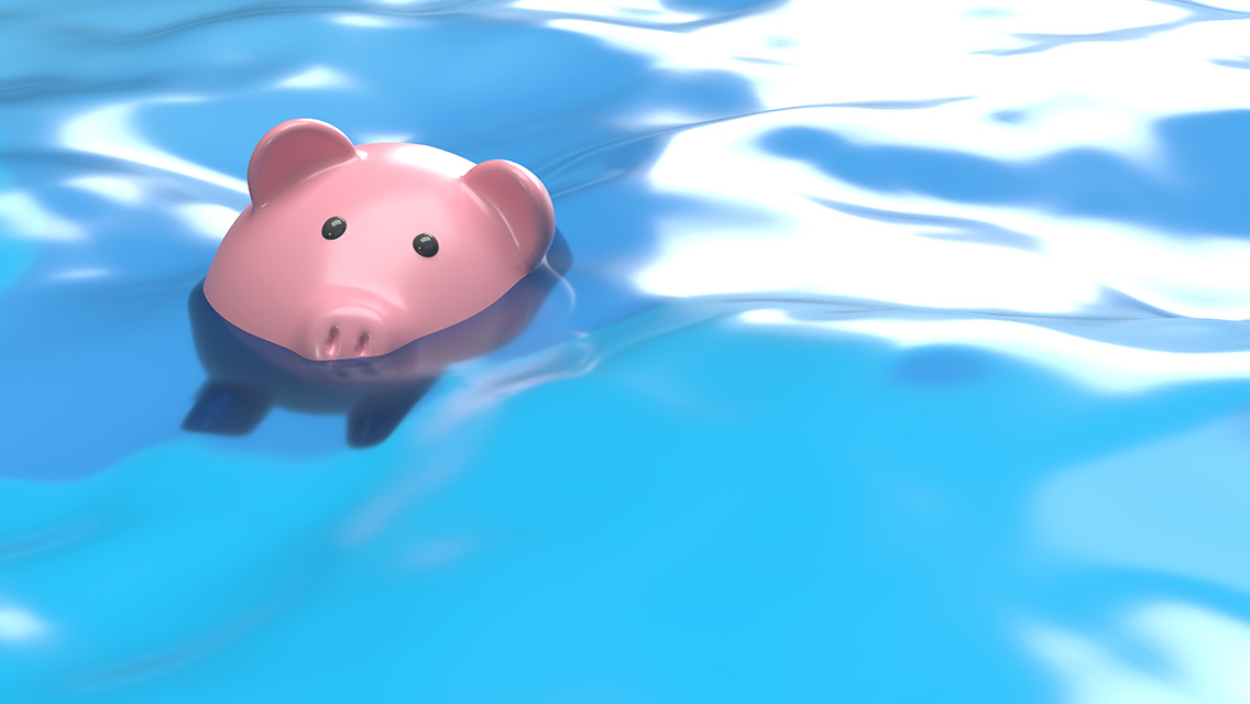 a pink piggy pink sinking in water