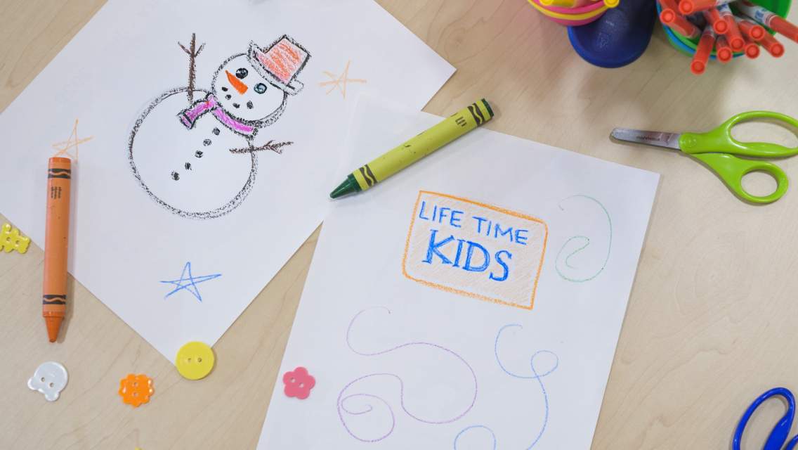 paper and crayons on table