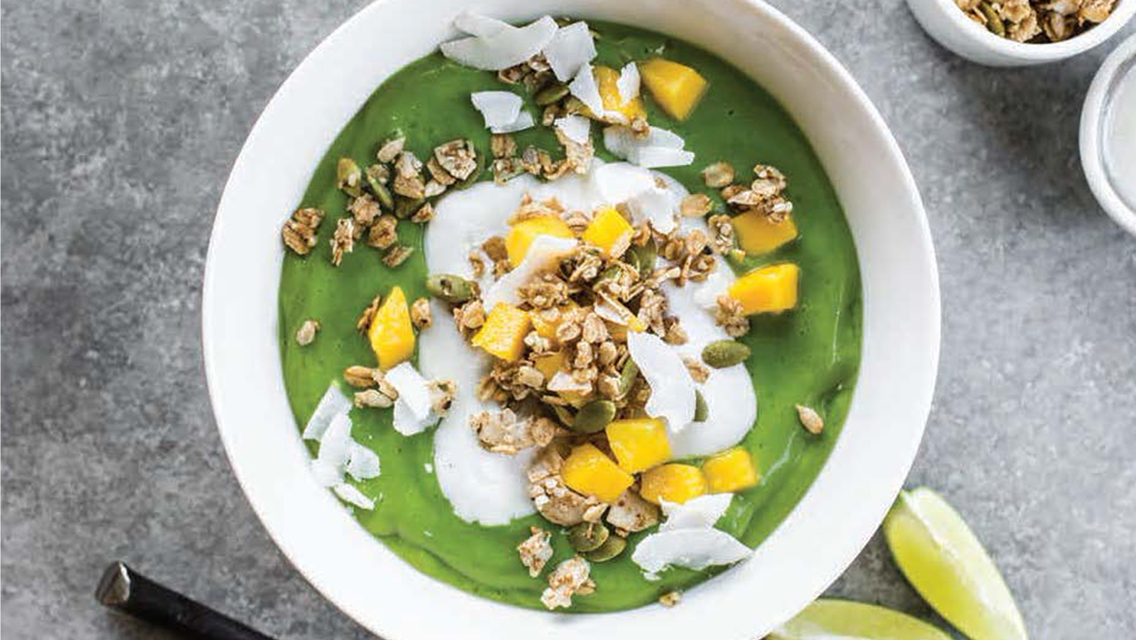 green team smoothie bowl topped with granola