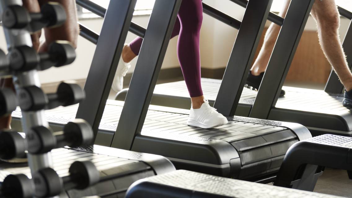 Person walking on a treadmill at Life Time