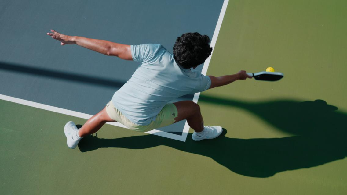 A man playing pickleball