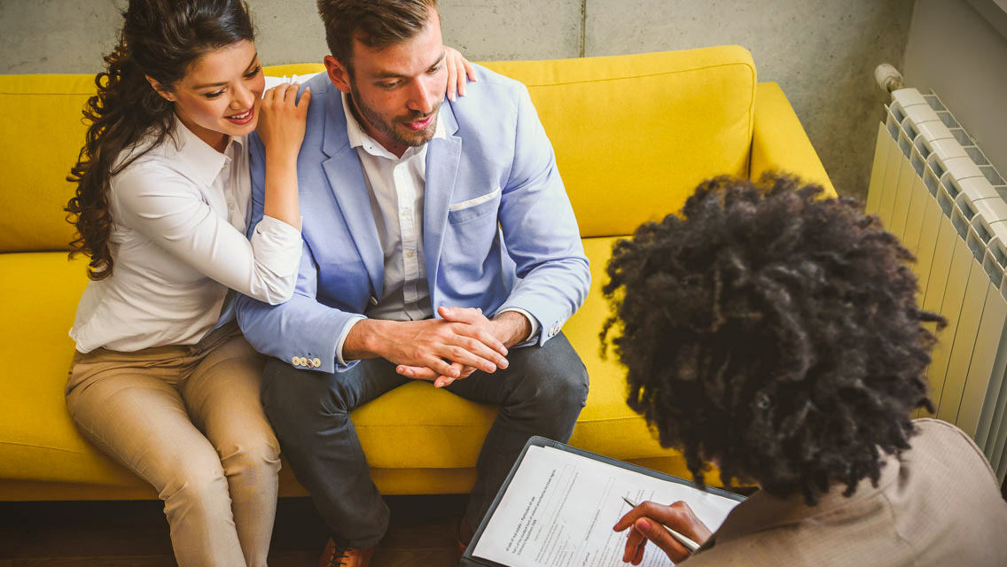 a couple talks to a therapist