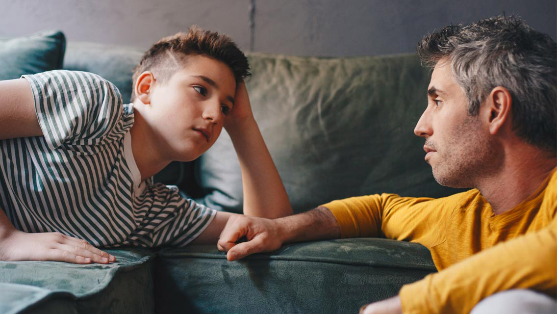 a father and son talking