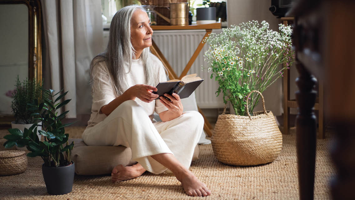 a woman sit on a meditation cushion