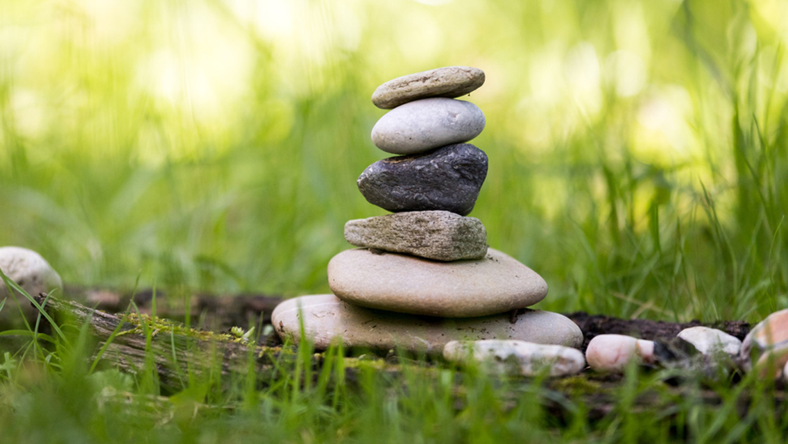 Stone cairn in the park. Balance and relaxation