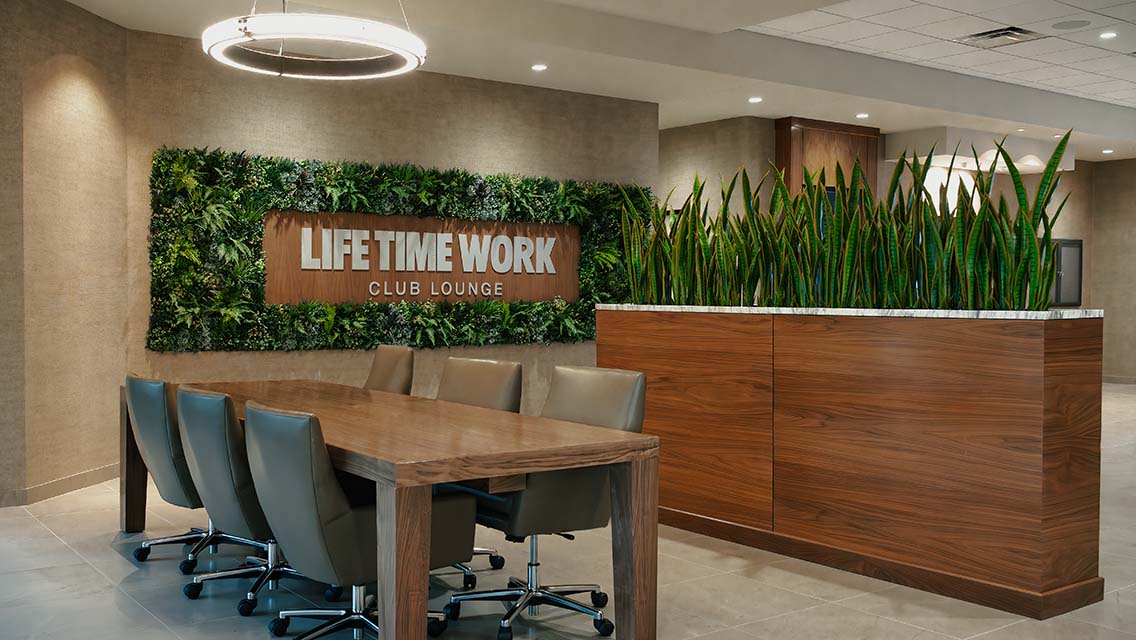 life time work club lounge table with greenery