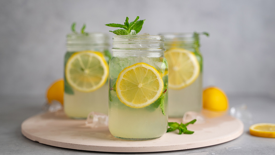 Three glasses of water with lemon