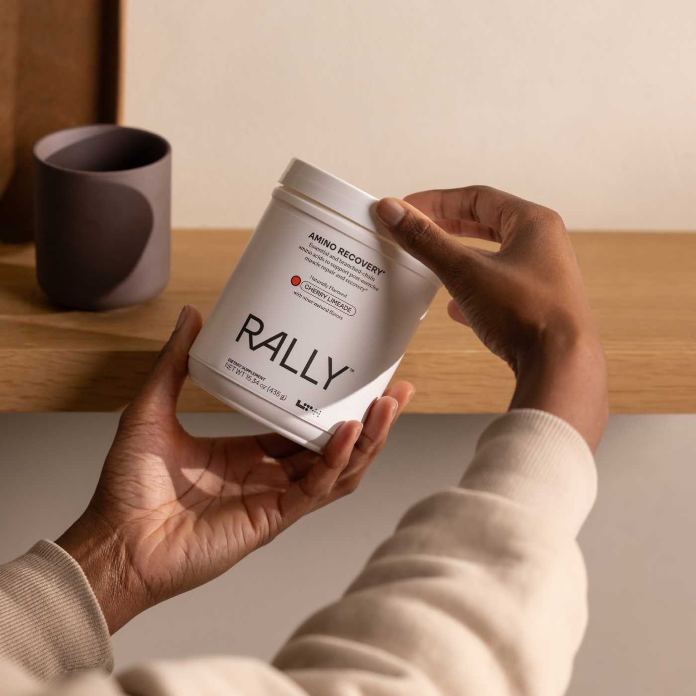 person holding tub of LTH rally