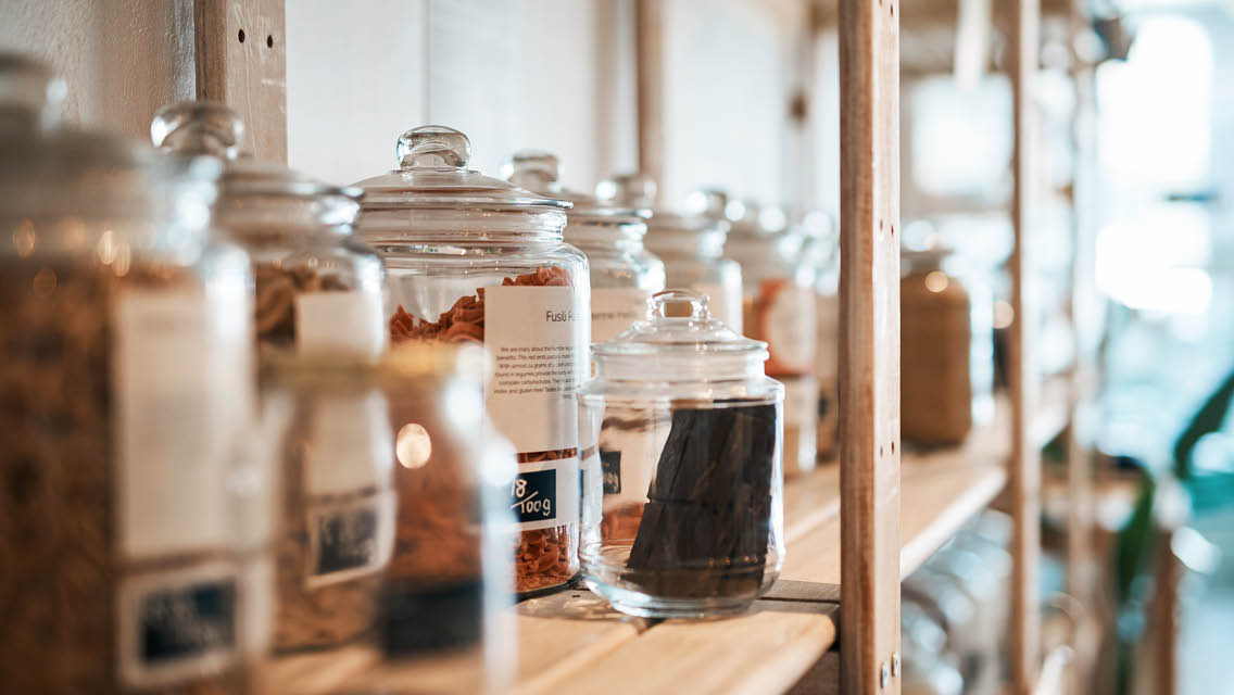 shop shelves with bulk items stored in glass containers