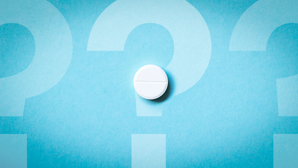 should you take a daily aspirin? And aspirin pill sits on a question mark