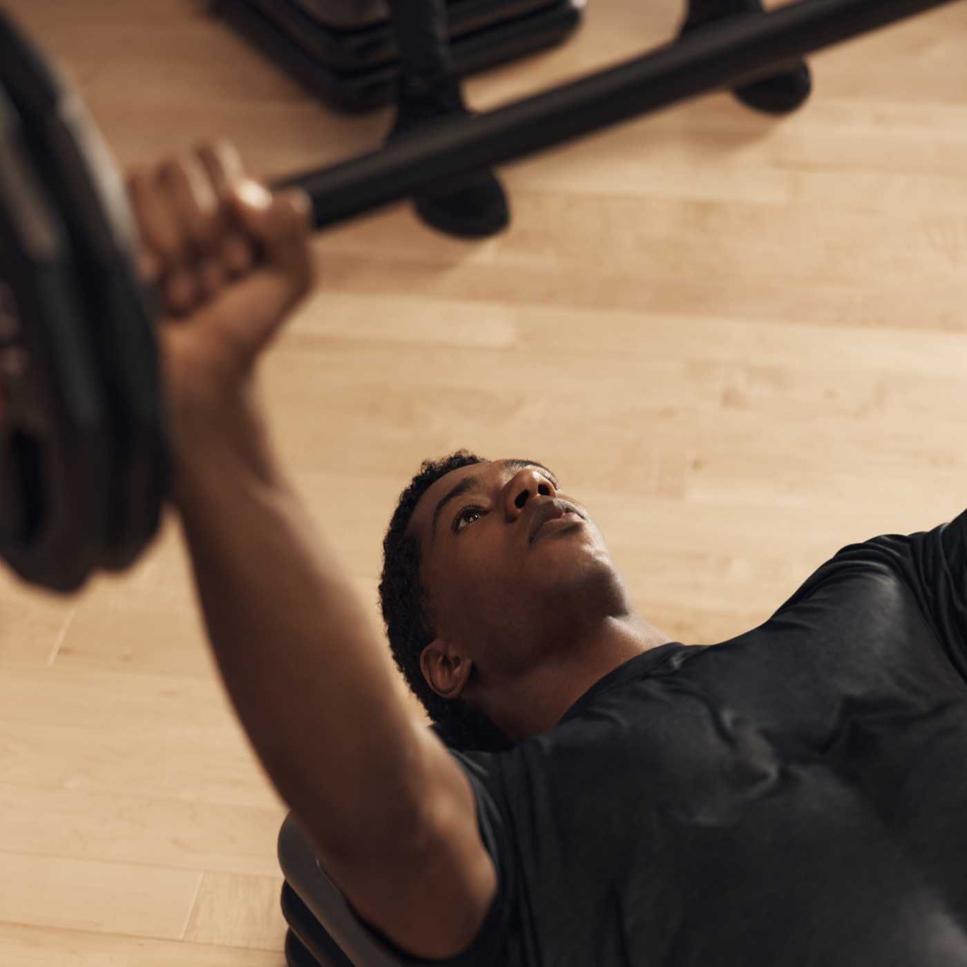man lifting weights