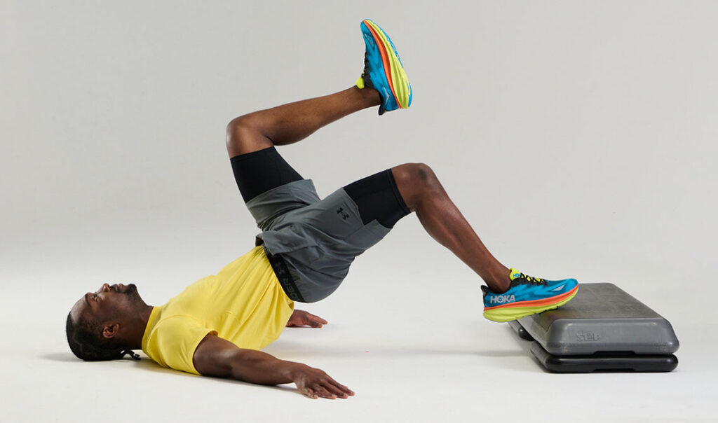 single leg glute bridge using step, with 1 riser