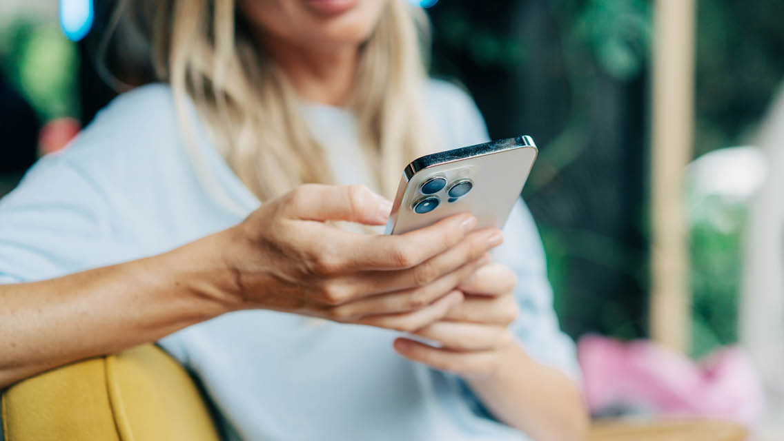 a woman plays on her phone