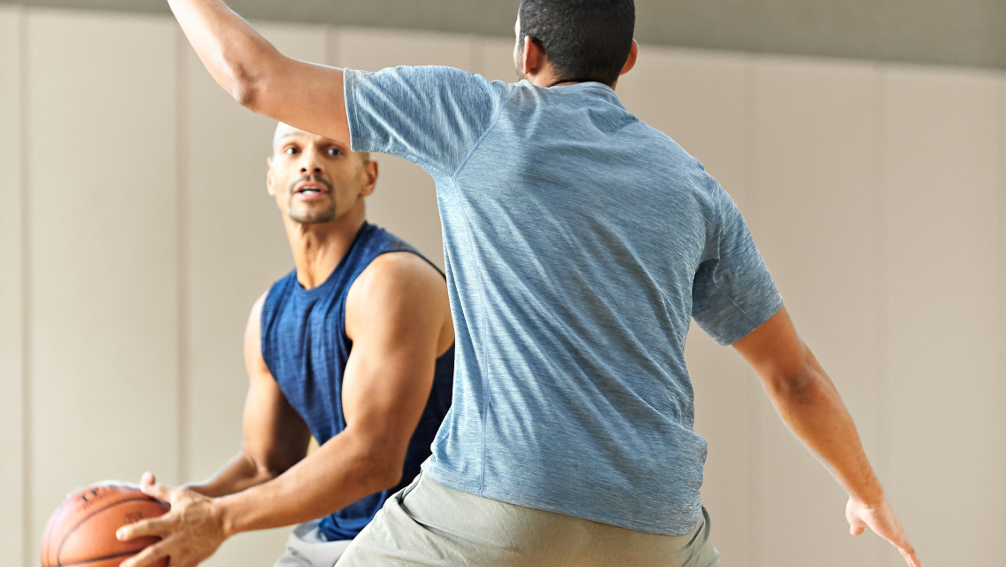 two men playing basketball