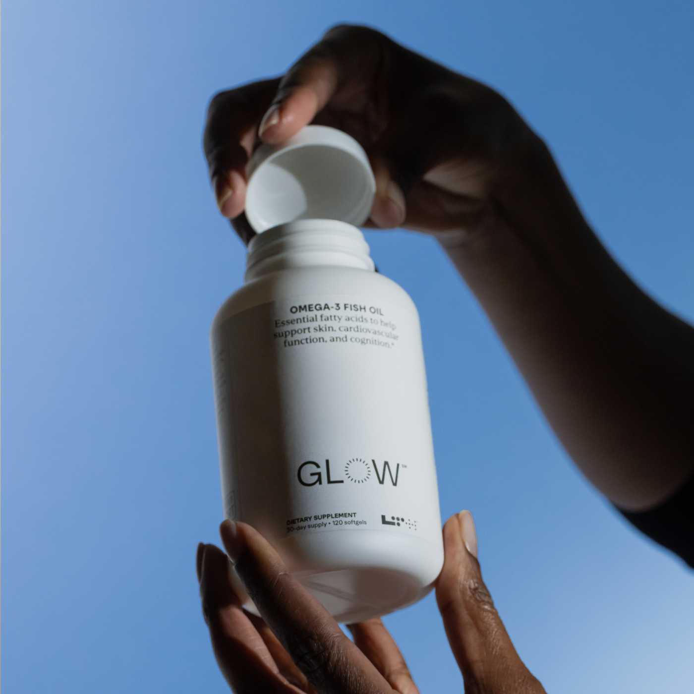 person holding tub of glow