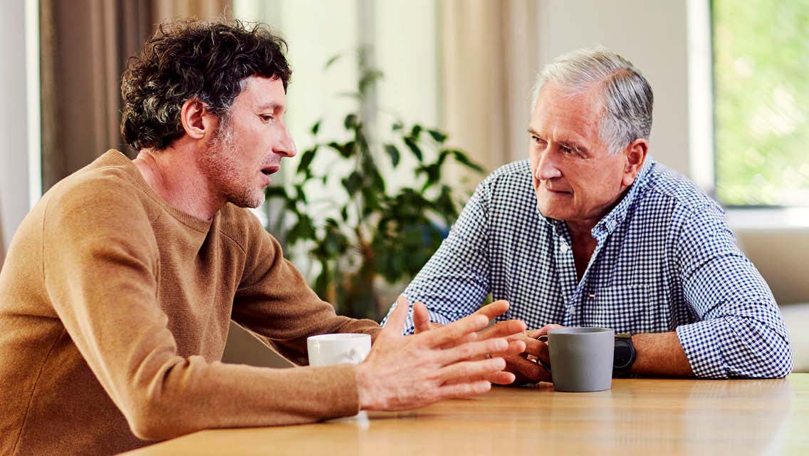 a father and son talking.