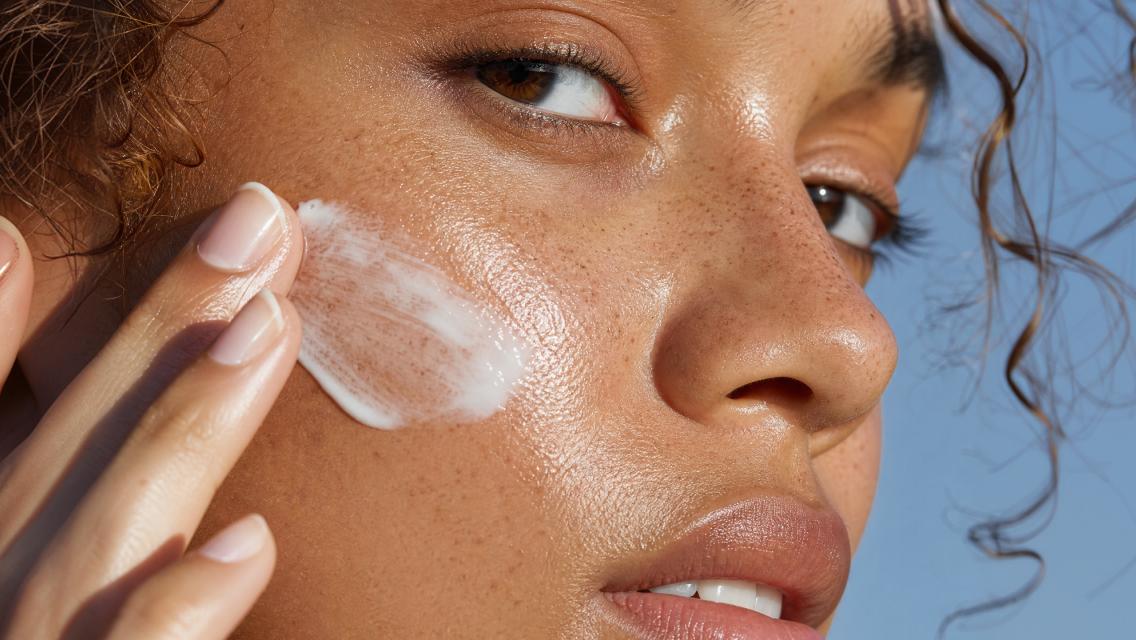 woman with sunscreen on her face