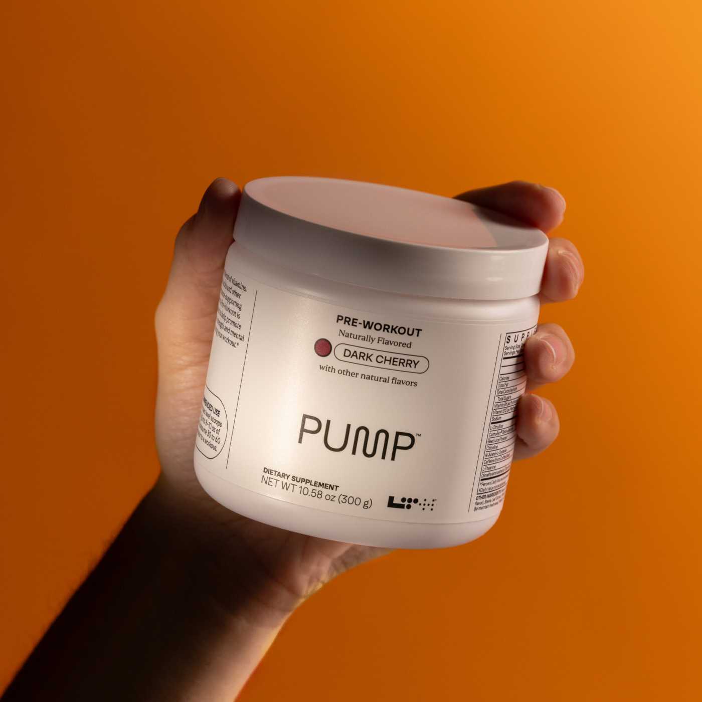 hand holding tub of pump